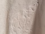 the back of a white shirt with a picture of a bear on it