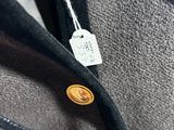 a close up of a jacket with a tag on it