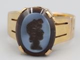 an image of a ring with a silhouette of a man in a hat