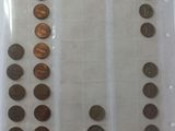 several different types of coins are shown on a sheet of paper