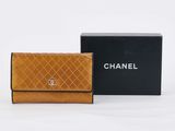 a chanel wallet with a box on the side