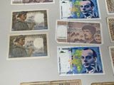 a lot of different bank notes on the table