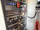 a room with a lot of wires and wires on the wall
