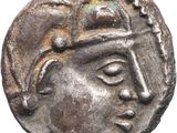 une pièce d'argent sur laquelle figure l'effigie d'un homme portant un casque