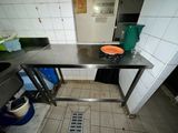 a table with a bowl on it in a kitchen