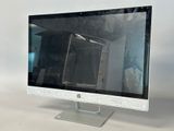 a computer monitor sitting on top of a desk