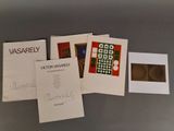 several cards and envelopes of various designs on a gray surface