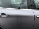 a cat sitting in the passenger seat of a car