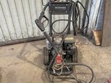 an image of a pressure washer in a garage