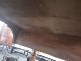 a man that is working on a boat in the water