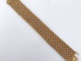 a gold bracelet with a clasp on it