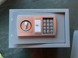 a small safe box with a key lock on it