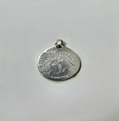 a close up of a coin on a white surface