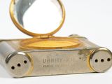 a small metal object with a mirror on it