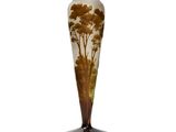 an image of a glass vase with trees on it on a white background