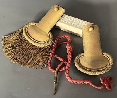 a broom, a brush, and some other items on a table