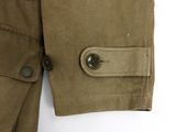 an image of a close up of a jacket with a button on it