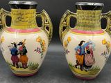 two vases that have been painted with people on them