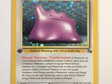 a purple pokemon card with a picture of a cat on it
