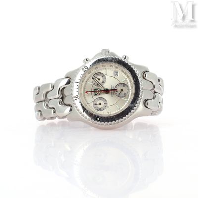 a close up of a wrist watch on a white surface