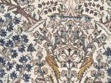 an oriental rug with birds and flowers on a white ground