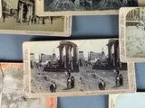 many old photos of people and buildings on the wall