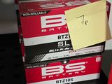 a stack of boxes with a note on top of them