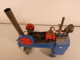 a small blue machine that is sitting on a table