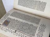 an open book sitting on top of a wooden table