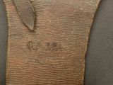 an image of a close up of a leather case with a metal handle