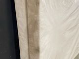 a mattress that has been wrapped up in plastic