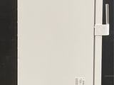 an image of a white refrigerator in a room