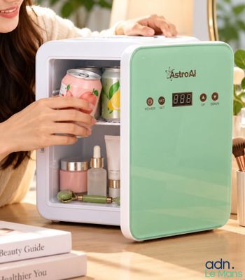 a woman that is looking inside of a mini fridge