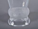 a clear glass vase sitting on top of a table