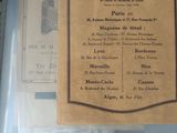un menu du restaurant « Kodak - Patte » posé sur la table