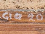 a close up of a sign on the side of a building
