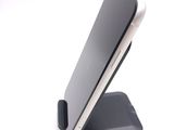 a cell phone that is sitting on top of a stand