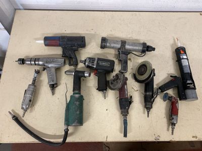 a lot of tools that are sitting on a table