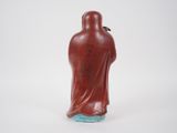 an image of a statue of a man in a red robe
