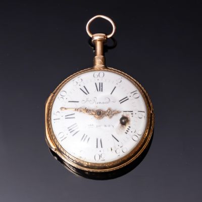 Une montre à boitier rond en or 750‰, le cadran en émail bla…