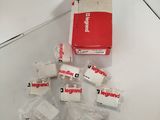 a box of bandages on a table next to a box of bandages