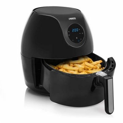 a black air fryer with french fries in it