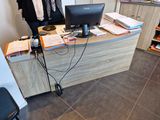 a desk with a computer and a monitor on it