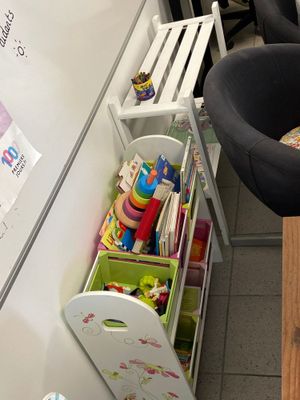 a small child ' s play area in the corner of the room