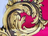 a close up of a tie with a gold design on it