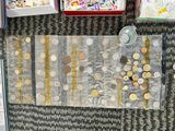 a lot of coins on a table with a lot of other things