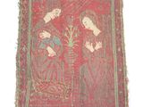 a close up of a piece of cloth with a woman and child on it