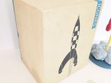 a cardboard box that has a rocket on it