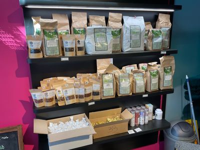 many bags of food on the shelves in the store