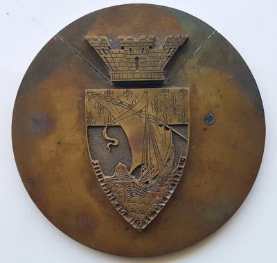 a metal plaque with a crown on it